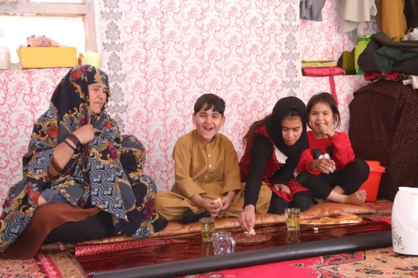 Shila’s children enjoy sharing meals at their home in the Shindand district of Herat province