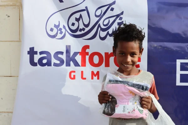 A displaced child in Port Sudan, Sudan, receives an Islamic Relief Eid gift